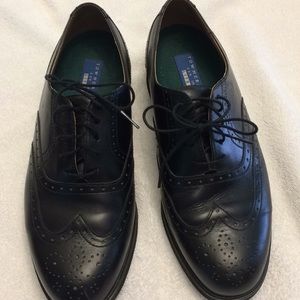 Wing tip dress shoes